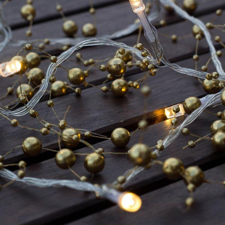 Levně DecoLED LED světelný řetěz na baterie - zlaté perly, teple bílá, 10 diod, 1,3m